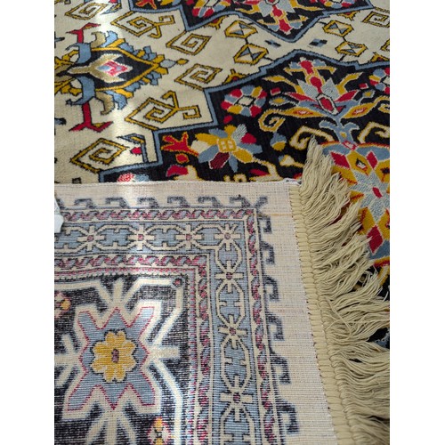 2325 - A modern Saudi Arabian part silk cream ground Persian design carpet. Length 388cm, width 187cm.