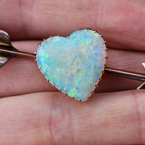 1100 - A large Antique 9ct rose gold opal 'Heart and Arrow' brooch, maker G&SA, set with heart cabochon whi... 