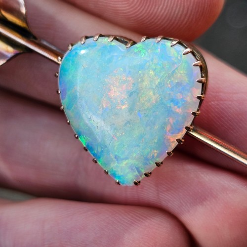 1100 - A large Antique 9ct rose gold opal 'Heart and Arrow' brooch, maker G&SA, set with heart cabochon whi... 