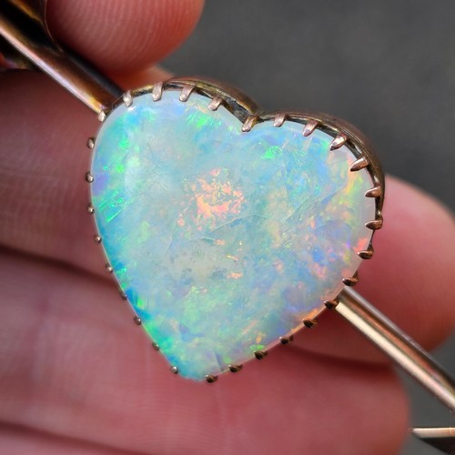 1100 - A large Antique 9ct rose gold opal 'Heart and Arrow' brooch, maker G&SA, set with heart cabochon whi... 