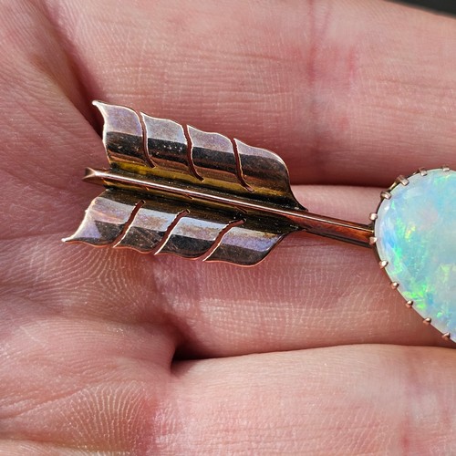 1100 - A large Antique 9ct rose gold opal 'Heart and Arrow' brooch, maker G&SA, set with heart cabochon whi... 