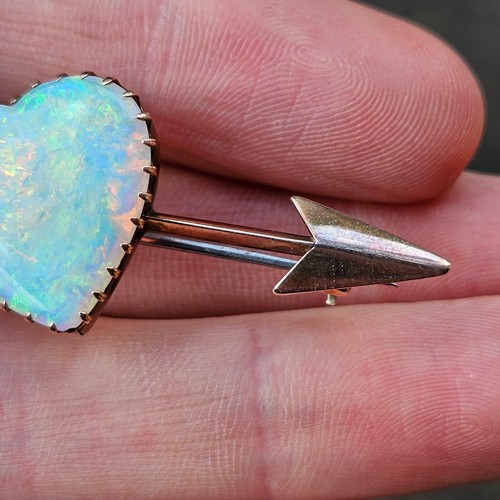 1100 - A large Antique 9ct rose gold opal 'Heart and Arrow' brooch, maker G&SA, set with heart cabochon whi... 