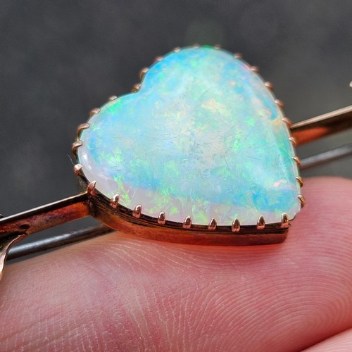 1100 - A large Antique 9ct rose gold opal 'Heart and Arrow' brooch, maker G&SA, set with heart cabochon whi... 