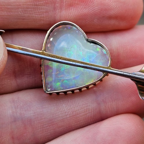 1100 - A large Antique 9ct rose gold opal 'Heart and Arrow' brooch, maker G&SA, set with heart cabochon whi... 