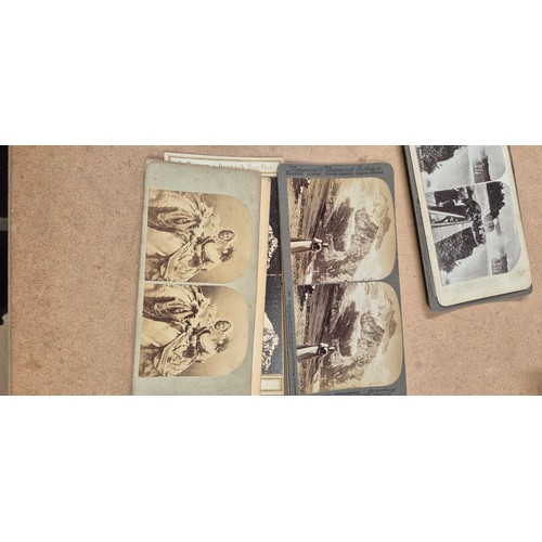 188 - A collection of Vintage stereoscopic cards, together with 2 stereoscopes