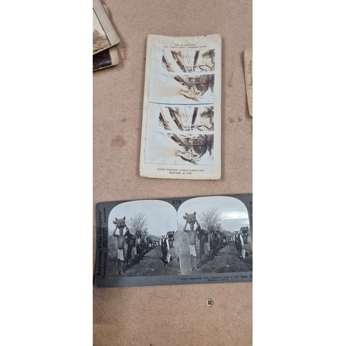 188 - A collection of Vintage stereoscopic cards, together with 2 stereoscopes