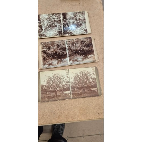 188 - A collection of Vintage stereoscopic cards, together with 2 stereoscopes