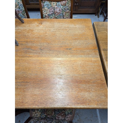 2560 - A 1930s oak dining table, with end frieze drawer and raised on tapered legs. Length 175cm, height 76... 