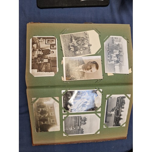 165 - A mixed album of Vintage postcards, including military, family, topographical and greetings cards