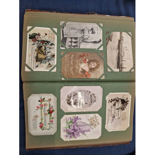 165 - A mixed album of Vintage postcards, including military, family, topographical and greetings cards