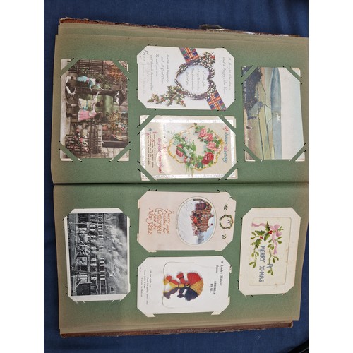 165 - A mixed album of Vintage postcards, including military, family, topographical and greetings cards