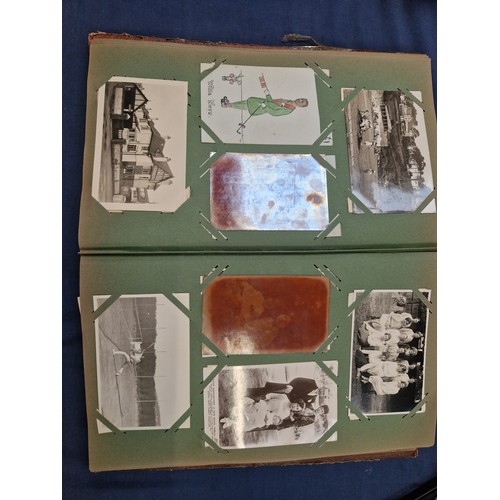 165 - A mixed album of Vintage postcards, including military, family, topographical and greetings cards