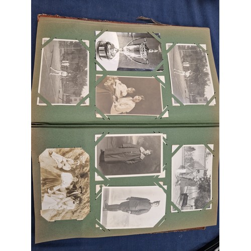 165 - A mixed album of Vintage postcards, including military, family, topographical and greetings cards