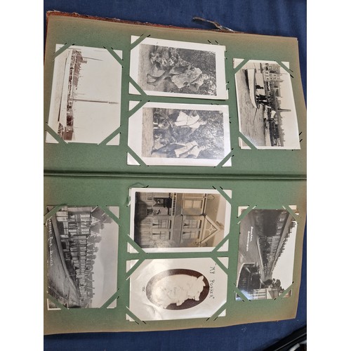 165 - A mixed album of Vintage postcards, including military, family, topographical and greetings cards