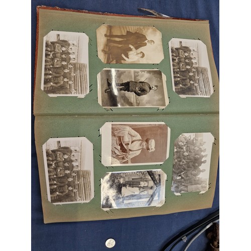 165 - A mixed album of Vintage postcards, including military, family, topographical and greetings cards