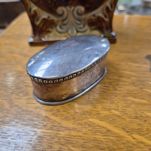 217 - A late Victorian Doulton Lambeth silver-mounted stoneware pottery tea caddy, of rectangular waisted ... 