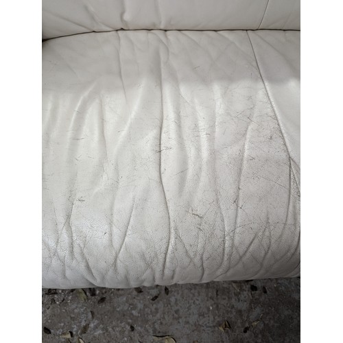 2663 - LIGNE ROSET - A contemporary white leather upholstered two-seater sofa. Overall width 145cm, height ... 