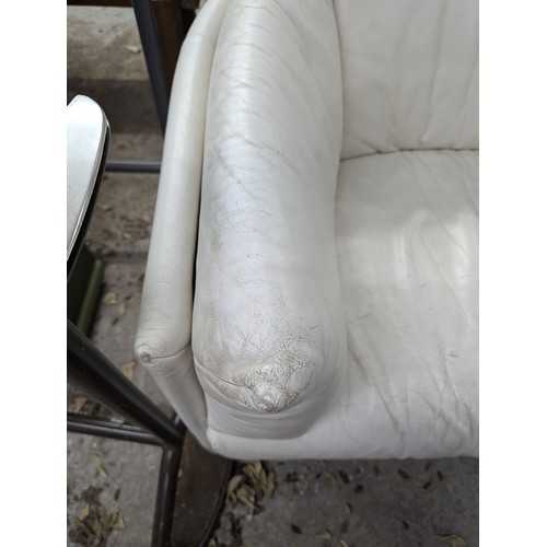 2663 - LIGNE ROSET - A contemporary white leather upholstered two-seater sofa. Overall width 145cm, height ... 