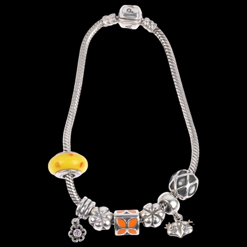 1579 - PANDORA - a sterling silver snake link charm bracelet, with 7 silver charms, 19.5cm, 33.6g