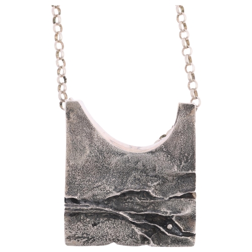 1622 - KNUD JORGENSEN RANDERS - a Danish brutalist oxidised sterling silver abstract pendant necklace, on s... 