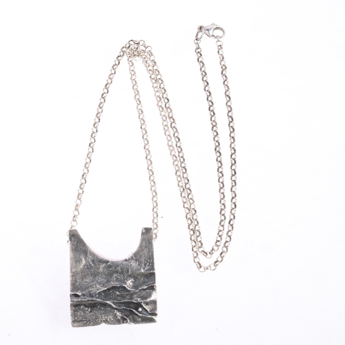 1622 - KNUD JORGENSEN RANDERS - a Danish brutalist oxidised sterling silver abstract pendant necklace, on s... 