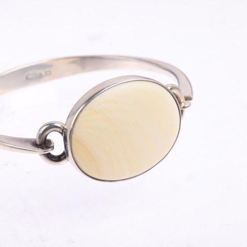 1644 - NIELS ERIK FROM - a Danish modernist sterling silver and marine ivory torque bangle, setting height ... 