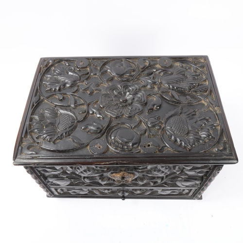 14 - An early 19th century Sri Lankan ebony box, circa 1830, relief carved allover with hinged lid and dr... 