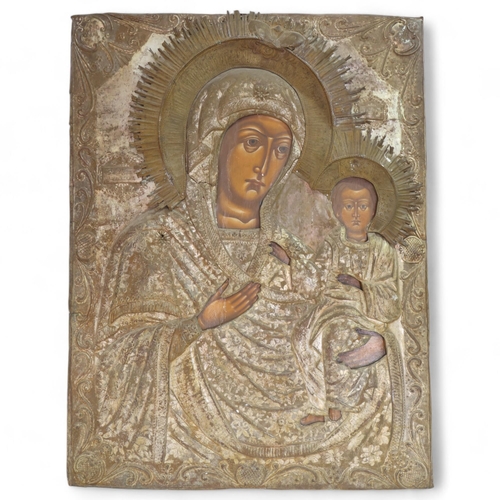 23 - A large Antique Russian icon, depicting Mother of God and Infant Christ, oil on wood panel with reli... 