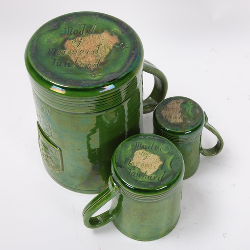 30 - Rye Pottery, 3 graduated green glaze tankards, inscribed model of mermaid tankard Rye 1926, with rel... 