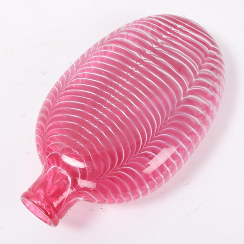 32 - A 19th century hand-blown cranberry glass flask with trailed white decoration, length 19cm