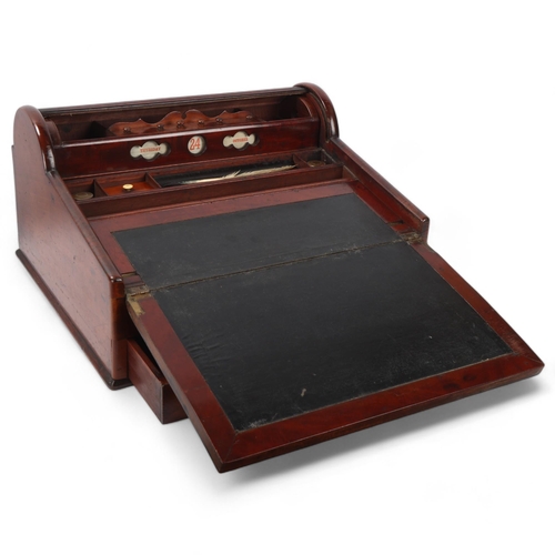 34 - A 19th century mahogany campaign writing slope, with tambour compartment and recessed brass handle, ... 