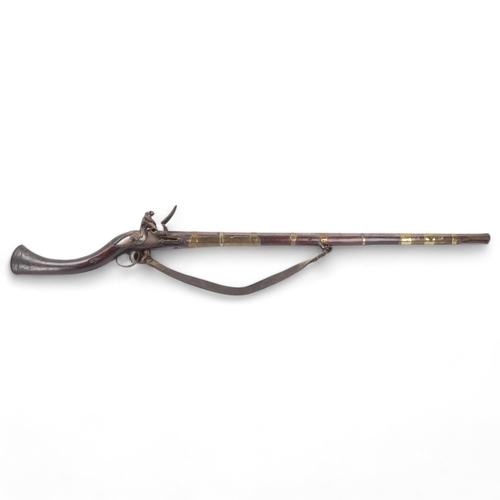 36 - Antique Indian flintlock rifle, overall length 126cm