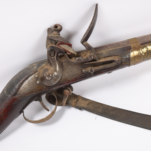 36 - Antique Indian flintlock rifle, overall length 126cm