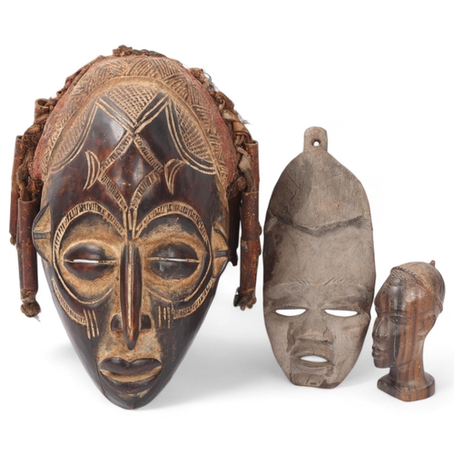 46 - 2 African carved wood Tribal masks, and a hardwood head sculpture (3)