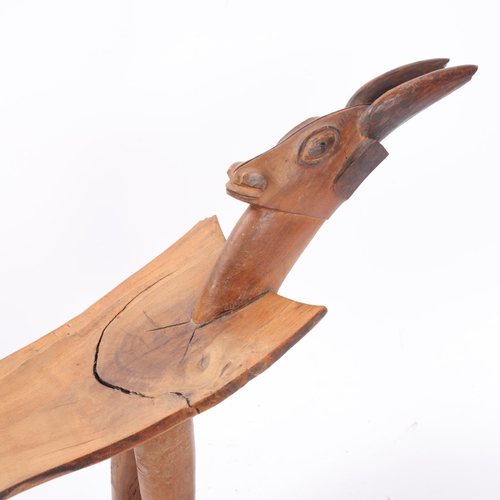 50 - A Lobi figural Tribal wooden stool, in the manner of Sikire Kanbire of Gaoua, with antelope design t... 