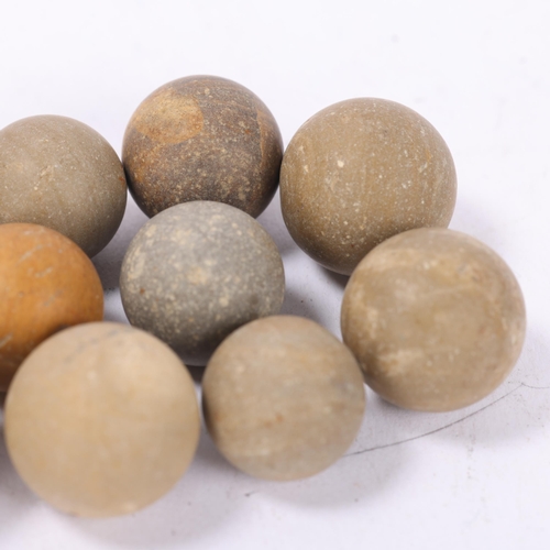 55 - 10 ancient Roman clay marbles or gaming counters