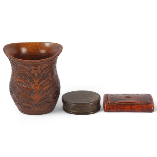 104 - A 19th century treen snuffbox, length 7.5cm, an oval horn snuffbox, and a relief carved wood vase (3... 