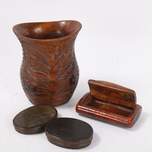 104 - A 19th century treen snuffbox, length 7.5cm, an oval horn snuffbox, and a relief carved wood vase (3... 