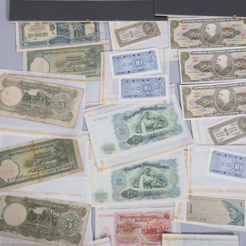 106 - A collection of late 19th and 20th century world banknotes, including China, Japan, Korea, Paraguay,... 