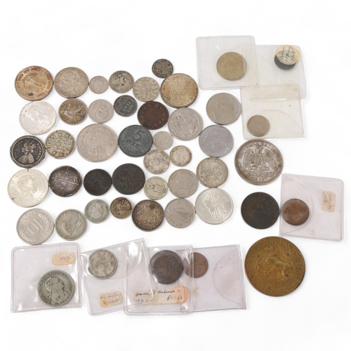 120 - A collection of foreign silver and copper coins, including a silver Joan of Arc medallion