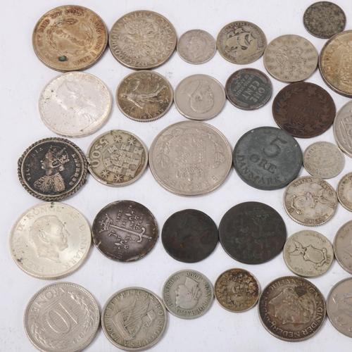 120 - A collection of foreign silver and copper coins, including a silver Joan of Arc medallion