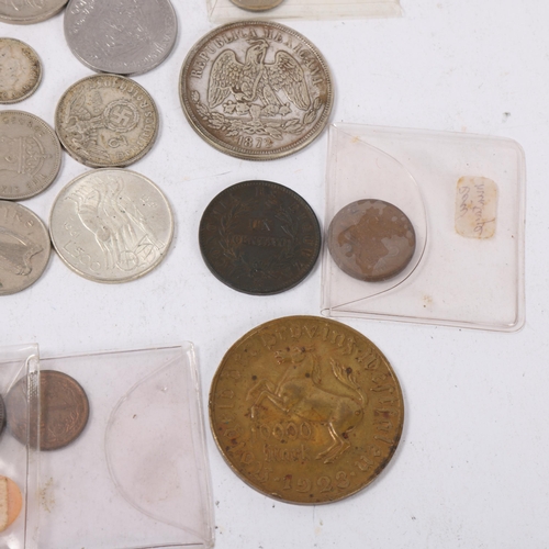 120 - A collection of foreign silver and copper coins, including a silver Joan of Arc medallion