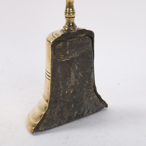 129 - An 18th century brass and lead weighted half-bell design doorstop, height 26cm