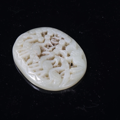 149 - A Chinese relief carved and pierced jade pendant, stork design, Qing Dynasty, 6.5cm x 5.5cm