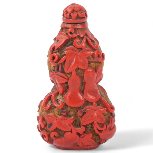 150 - A Chinese relief carved cinnabar double-gourd snuff bottle and stopper, Qing Dynasty, height 8.5cm