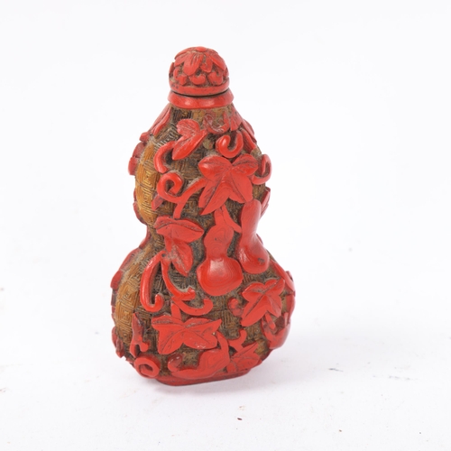 150 - A Chinese relief carved cinnabar double-gourd snuff bottle and stopper, Qing Dynasty, height 8.5cm