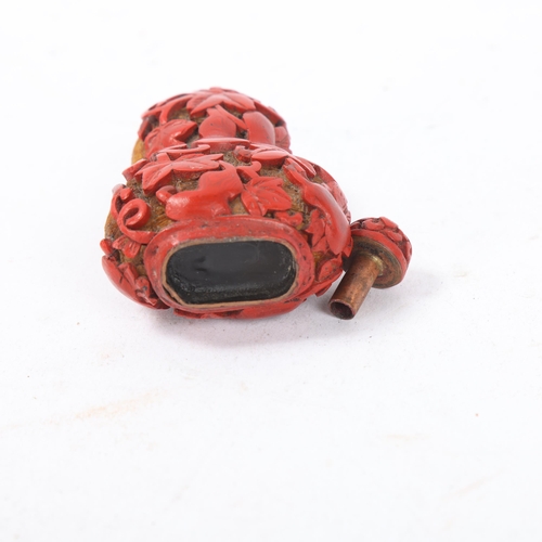 150 - A Chinese relief carved cinnabar double-gourd snuff bottle and stopper, Qing Dynasty, height 8.5cm