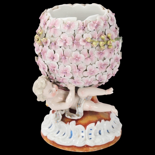 160 - 19th century Continental porcelain floral encrusted pot supported by a putti, faint diamond registra... 