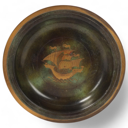 163 - A Danish mid-20th century patinated bronze bowl, depicting a galleon, diameter 26cm