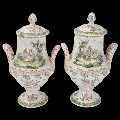 82 - Pair of late 19th/early 20th century French faience lidded vases, each finely painted with romantic ... 